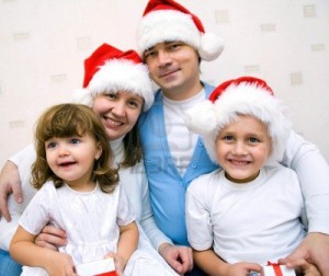 The Happy Family With Two Small Children In Christmas Caps …