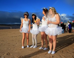 Brace yourselves for the cold! Christmas Day swimmers prepare to take the plunge into icy water